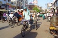 Rickshaw driver working on the street of Indian city