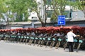 Rickshaw drivers are resting in the street (China).