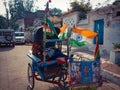 a rickshaw parked with national indian flag decorations on road in india dec 2019