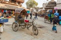 A rickshaw stands on Kathmandu Street.