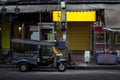 Rickshaw or tuk tuk taxi parked in the street