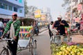 Rickshaws drive the vehicles on the market street