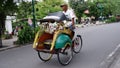 Rickshaws on Jalan Malioboro are a mode of transportation in Yogyakarta Indonesia: Yogyakarta-Indonesia, December 27, 2022