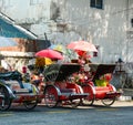 Rickshaws parking on street in George Town, Malaysia