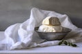 ricotta cheese in a cheesecloth on marble surface