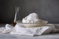 ricotta cheese in a cheesecloth on marble surface