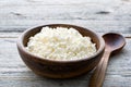 Ricotta cheese, cottage cheese farmers cheese, curd or tvorog in a wooden bowl