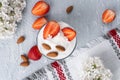 Ricotta dessert with fresh strawberries. Healthy breakfast of yogurt, strawberry and almonds Royalty Free Stock Photo