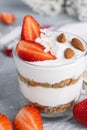Ricotta dessert with fresh strawberries. Healthy breakfast of yogurt, strawberry and almonds Royalty Free Stock Photo