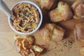 ricotta dip with sun-dried tomatoes and baked paprika in a ceramic white bowl and homemade popovers, which is a puffed Royalty Free Stock Photo