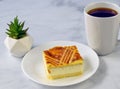 Ricotta lemon cheese square with a cup of coffeer Royalty Free Stock Photo