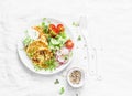 Ricotta zucchini fritters and fresh vegetables salad. Cucumbers, cherry tomatoes, radishes, micro greens and zucchini pancakes on Royalty Free Stock Photo