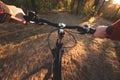 Ride a bike in the first person. Driving a bike in the forest