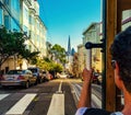 Ride with the cable car in San Francisco. Picture shows a person riding the famous MUNI train on Powell-Mason line.