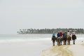 Ride on horseback on a tropical beach Royalty Free Stock Photo