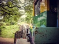 Ride a local old train over a small bridge in Thailand Royalty Free Stock Photo