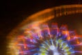 Ride in motion at the amusement park, night illumination. Long exposure Royalty Free Stock Photo