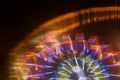 Ride in motion at the amusement park, night illumination. Long exposure Royalty Free Stock Photo