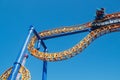 Ride roller coaster in blurred motion on sky background in amusement park Royalty Free Stock Photo