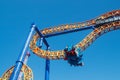 Ride roller coaster in blurred motion on sky background in amusement park Royalty Free Stock Photo