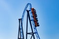 Ride roller coaster in blurred motion on sky background in amusement park Royalty Free Stock Photo