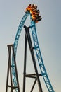 Ride roller coaster in blurred motion on sky background in amusement park Royalty Free Stock Photo