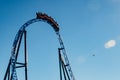 Ride roller coaster in blurred motion on sky background in amusement park Royalty Free Stock Photo