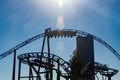 Ride roller coaster in blurred motion on sky background in amusement park Royalty Free Stock Photo