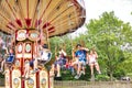 Ride Swing Carousel in motion in amusement park