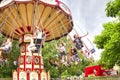 Ride Swing Carousel in motion in amusement park