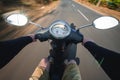 Rider driving scooter on an asphalt road. Motion blurred backgro Royalty Free Stock Photo