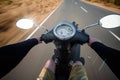 Rider driving scooter on an asphalt road. Motion blurred backgro Royalty Free Stock Photo