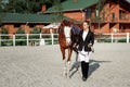 Rider elegant woman riding her horse outside