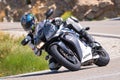 Rider in the foreground on his motorcycle in full competition