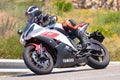 Rider in the foreground on his motorcycle in full competition