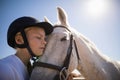 Rider girl embracing the horse Royalty Free Stock Photo
