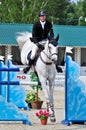 Rider on gray show jump horse