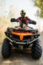 Rider in helmet on quad bike, front view, closeup Royalty Free Stock Photo