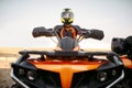 Rider in helmet on quad bike, front view, closeup Royalty Free Stock Photo