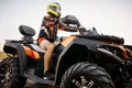 Rider in helmet on quad bike, front view, closeup Royalty Free Stock Photo