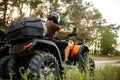 Rider in helmet on quad bike, front view, closeup Royalty Free Stock Photo