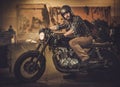 Rider and his vintage style cafe-racer motorcycle