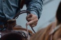 Rider holds onto reins of his horse