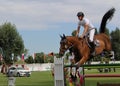 Rider on a Horse Jumping at Show Jumping Competition Royalty Free Stock Photo