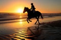 rider on horseback racing along the beach at sunrise Royalty Free Stock Photo