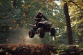 rider jumping atv over a forest log, leaves fluttering down Royalty Free Stock Photo