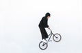 Rider jumping with a bicycle on a white background. Rider jump on bmx isolated on white background