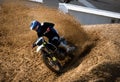 A rider on motorcycle throwing the dust from his tire while turning and acceleration Royalty Free Stock Photo