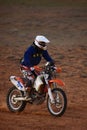 Rider on a off-road motorbike on the desert rally. Rally raid THE GOLD OF KAGAN-2021. 24.04.2021 Astrakhan, Russia