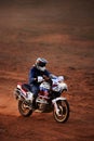 Rider on a off-road motorbike on the desert rally. Rally raid THE GOLD OF KAGAN-2021. 24.04.2021 Astrakhan, Russia